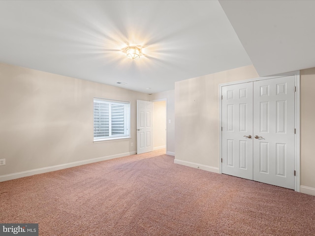 interior space with carpet flooring and a closet