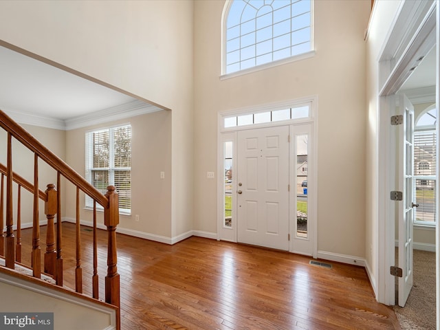 entryway with hardwood / wood-style floors and plenty of natural light