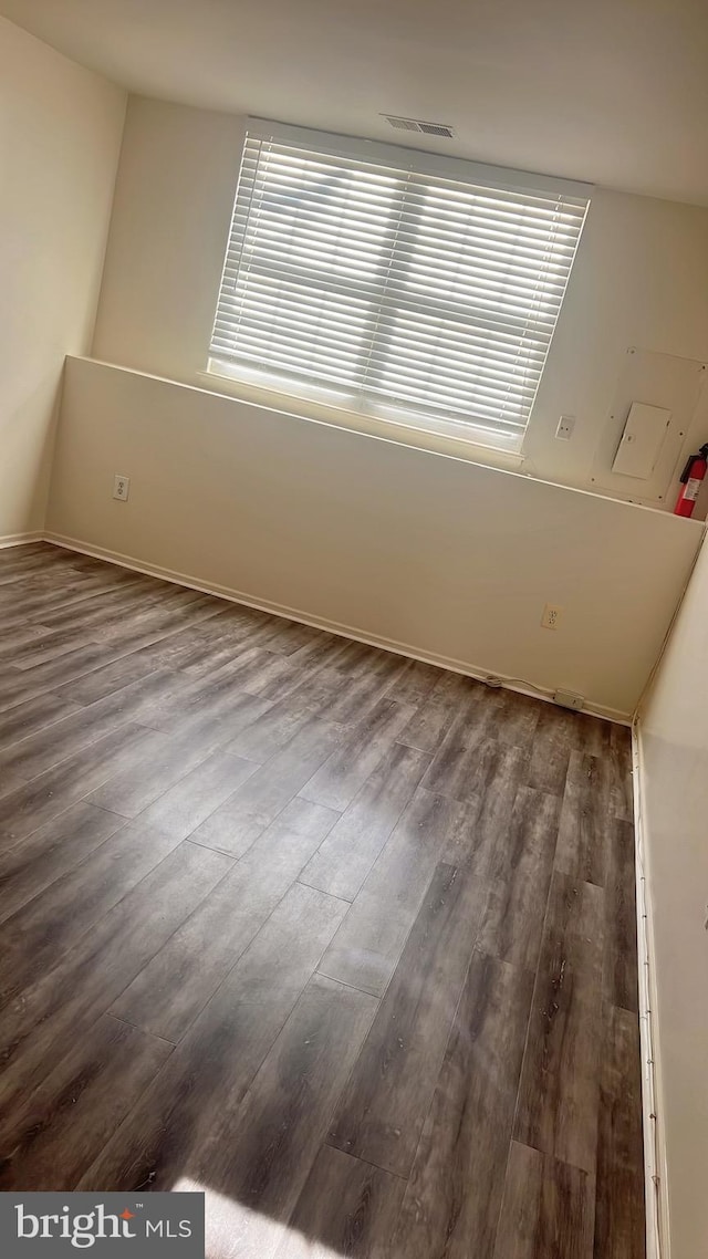 empty room featuring hardwood / wood-style flooring