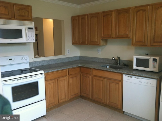 kitchen with white appliances, sink, light tile patterned floors, and ornamental molding