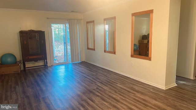 unfurnished room with dark hardwood / wood-style flooring and crown molding