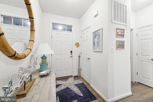 foyer entrance featuring hardwood / wood-style floors