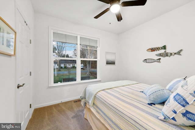 carpeted bedroom featuring ceiling fan