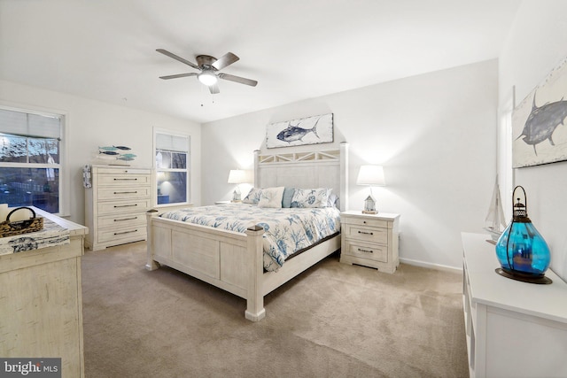 bedroom featuring ceiling fan and light colored carpet