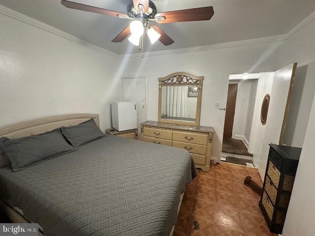 bedroom featuring parquet flooring, ceiling fan, and ornamental molding