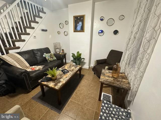 living room featuring tile patterned flooring