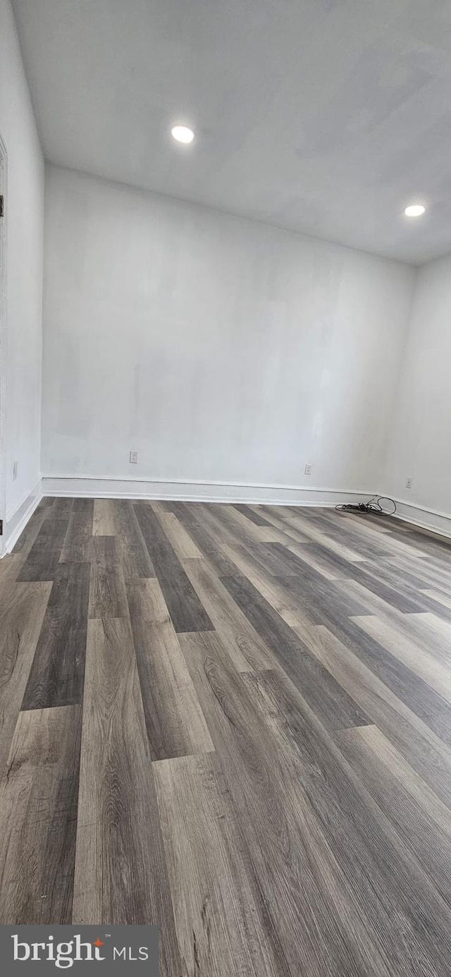 unfurnished room featuring hardwood / wood-style floors