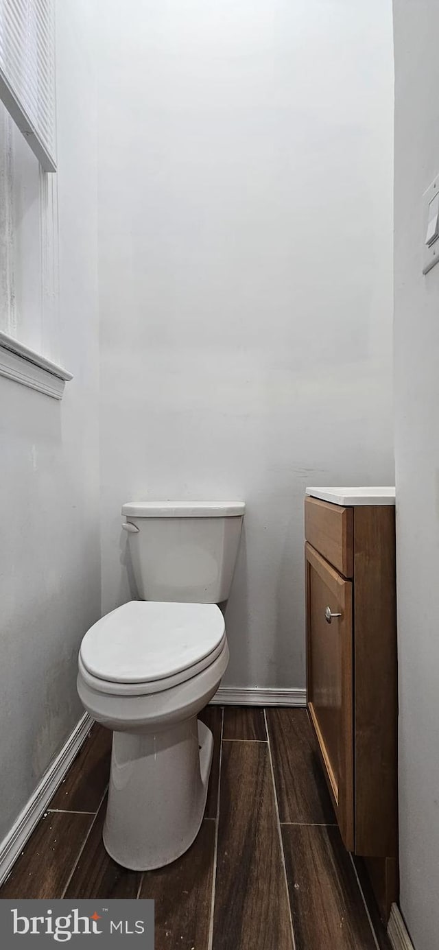 bathroom with toilet and vanity