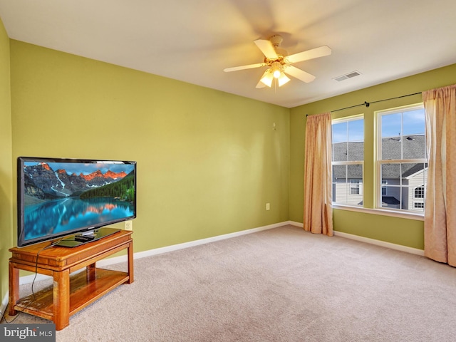 living room with carpet flooring and ceiling fan