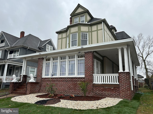 view of property exterior with covered porch