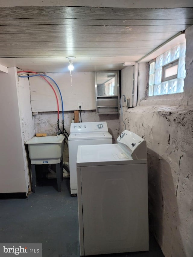 laundry room featuring sink and washing machine and clothes dryer