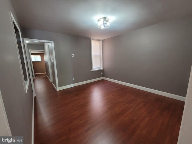 spare room featuring dark hardwood / wood-style flooring