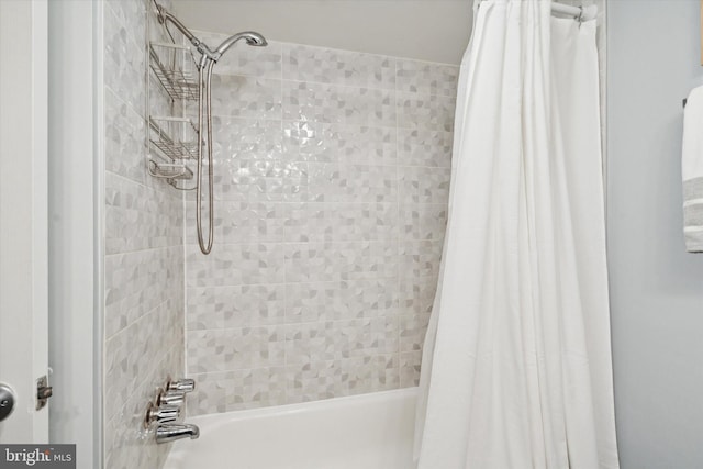 bathroom featuring shower / bathtub combination with curtain