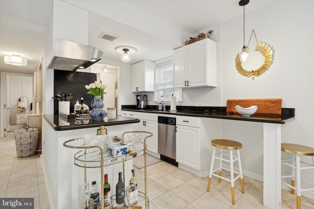 kitchen with light tile patterned floors, stainless steel dishwasher, a breakfast bar, white cabinets, and exhaust hood