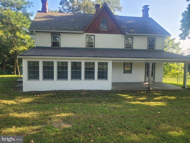 542 Auburn Rd, Landenberg, PA 19350 - rear view of house featuring stucco siding, a chimney, a yard, and a high end roof