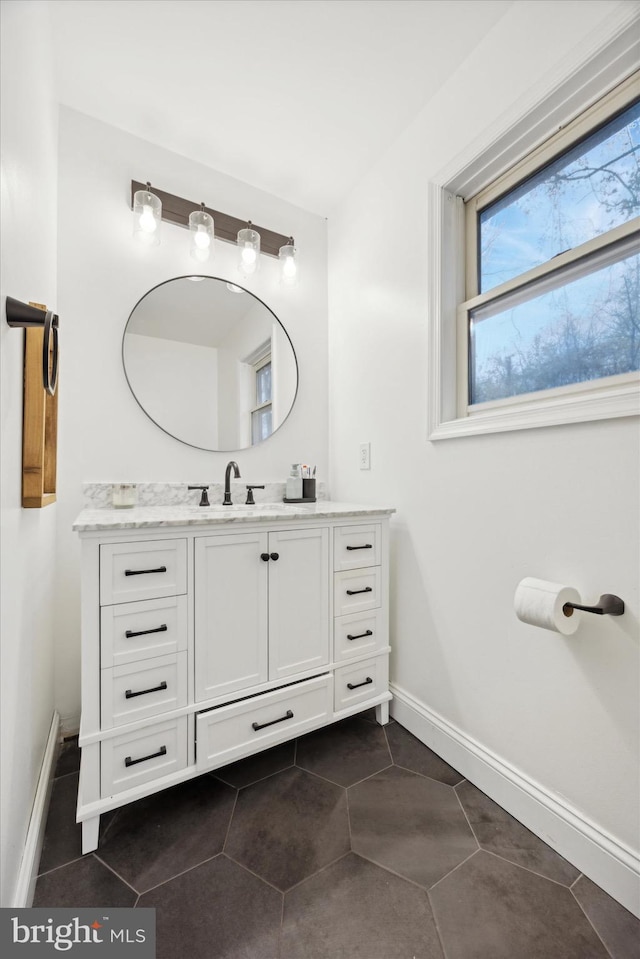 bathroom featuring tile patterned flooring and vanity