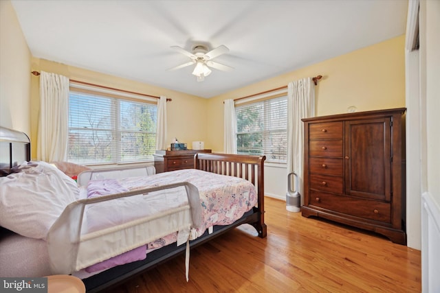 bedroom featuring ceiling fan and light hardwood / wood-style floors