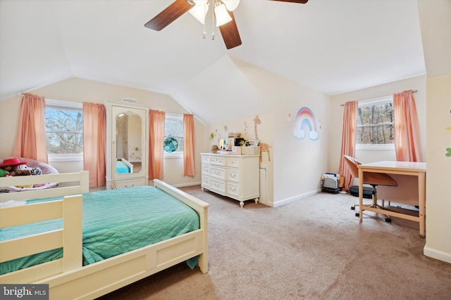 carpeted bedroom with ceiling fan and vaulted ceiling