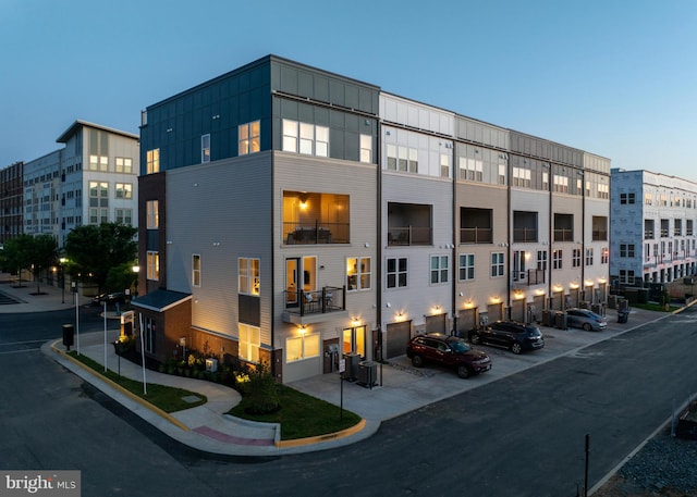 view of outdoor building at dusk