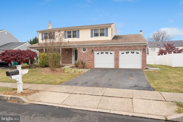 front of property featuring a front lawn and a garage