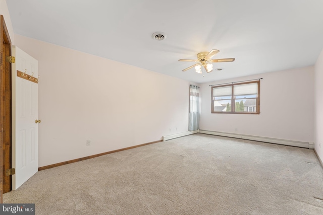 carpeted empty room with baseboard heating and ceiling fan