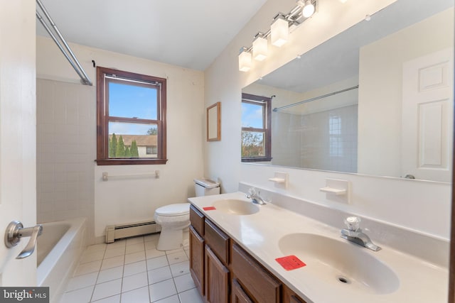 full bathroom with vanity, a baseboard heating unit, tile patterned floors, tiled shower / bath combo, and toilet