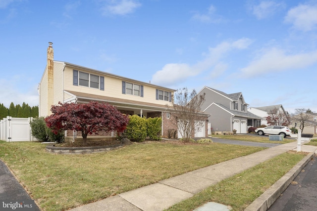 view of property featuring a front lawn