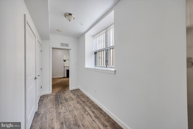 hall with dark hardwood / wood-style floors