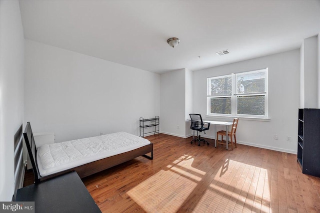 bedroom featuring hardwood / wood-style floors