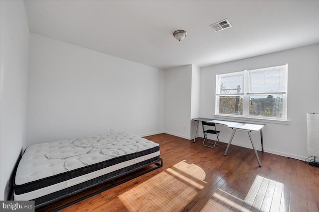 bedroom featuring hardwood / wood-style flooring