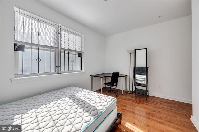 bedroom featuring hardwood / wood-style flooring