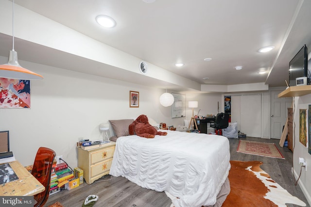 bedroom featuring dark wood-type flooring