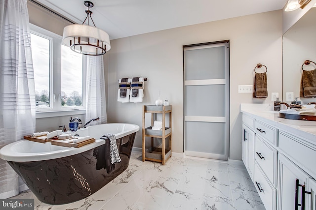 bathroom featuring a bath and vanity