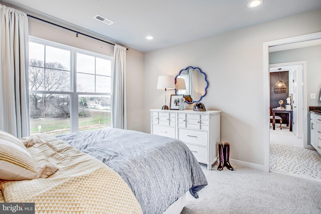 bedroom with light colored carpet