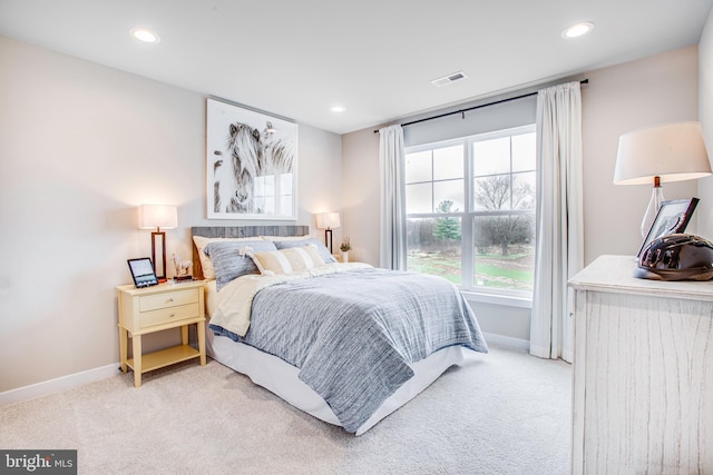 bedroom featuring light carpet