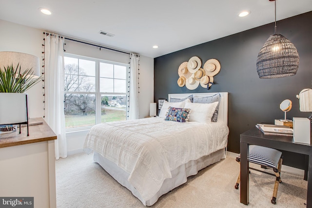 bedroom featuring light colored carpet