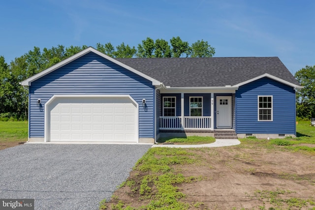 single story home with covered porch and a garage