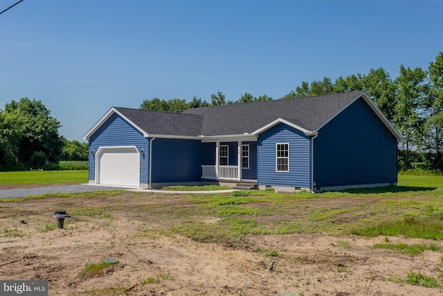 ranch-style house with covered porch, a front yard, and a garage