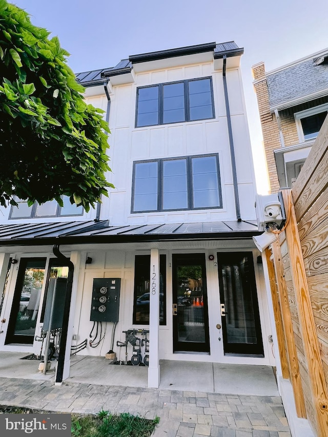1268 Holbrook Ter NE Unit 1, Washington, DC 20002 - rear view of house with a standing seam roof, metal roof, and a porch