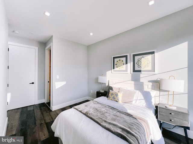 bedroom featuring dark hardwood / wood-style flooring