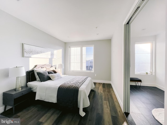 bedroom featuring dark wood-type flooring