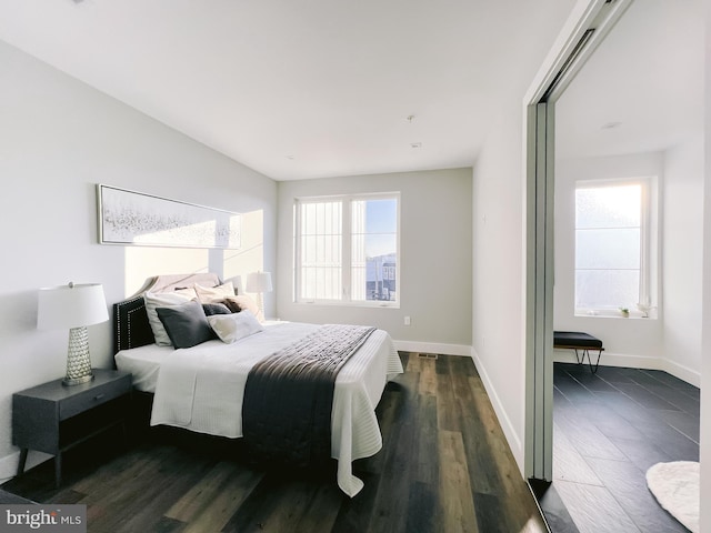 1268 Holbrook Ter NE Unit 1, Washington, DC 20002 - bedroom featuring dark wood-style flooring and baseboards