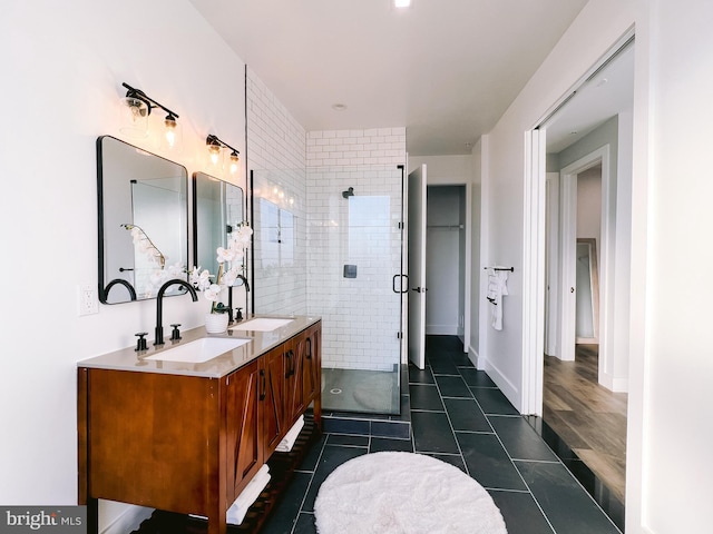 bathroom with tile patterned flooring, vanity, and an enclosed shower