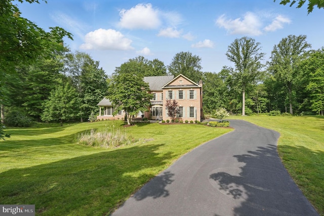 15280 Riding Club Dr, Haymarket, VA 20169 - view of front facade featuring a front yard and a chimney