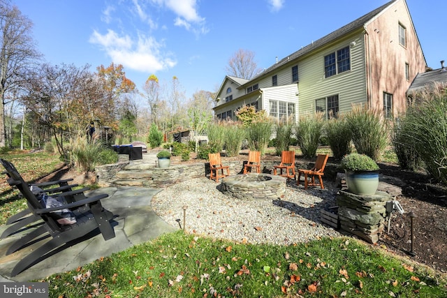 view of patio / terrace with an outdoor fire pit