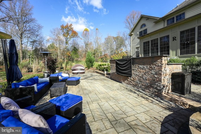 view of patio / terrace featuring outdoor lounge area and central AC unit