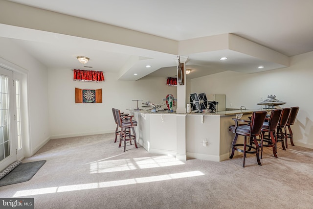 15280 Riding Club Dr, Haymarket, VA 20169 - kitchen with carpet, a kitchen breakfast bar, baseboards, and recessed lighting