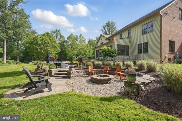 15280 Riding Club Dr, Haymarket, VA 20169 - view of grassy yard with an outdoor fire pit and a patio area