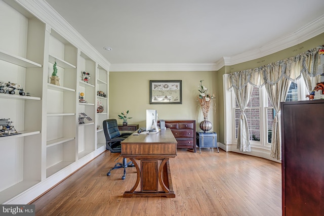 office with crown molding, hardwood / wood-style floors, and built in features