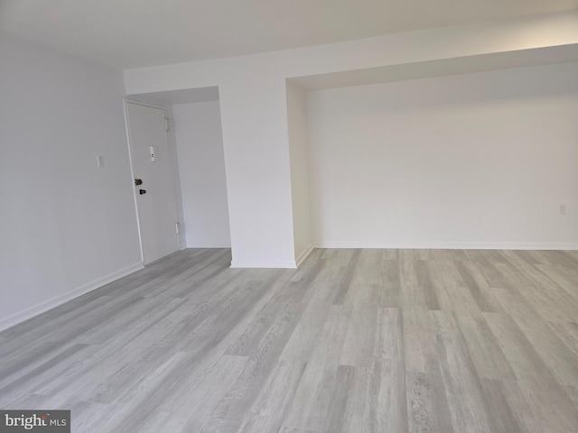 unfurnished room featuring light hardwood / wood-style flooring